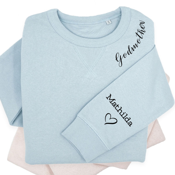UNISEX pastellfarbenes "Sully" Sweatshirt "Taufpatin" mit Kindernamen auf dem Ärmel UNISEX pastellfarbenes "Sully" Sweatshirt "Taufpatin" mit Kindernamen auf dem Ärmel